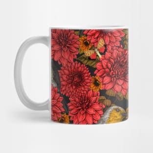 Robins in the autumn garden, red dahlias on black Mug